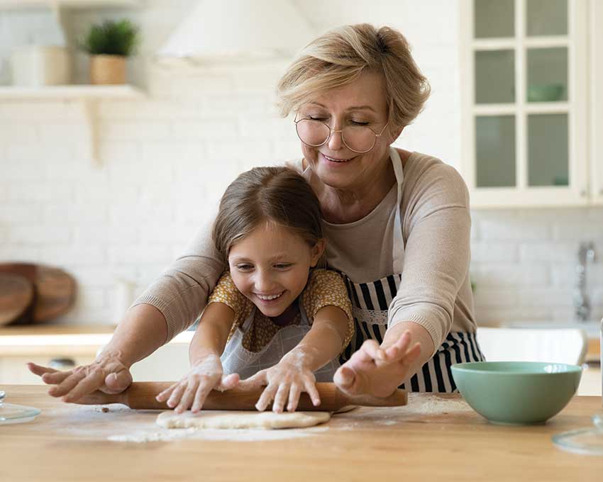 grandmother and granddaughter baking