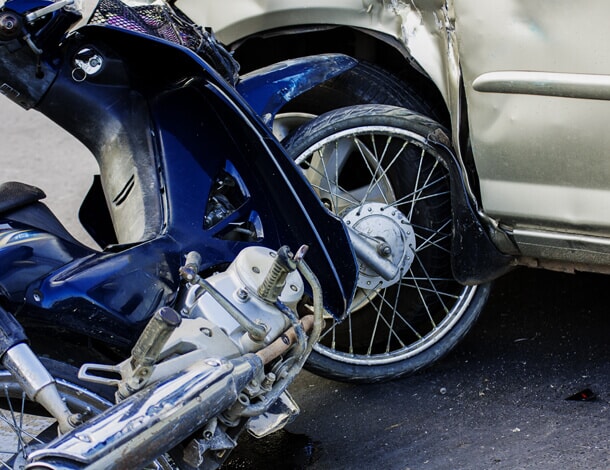 a motorcycle and a car after an accident