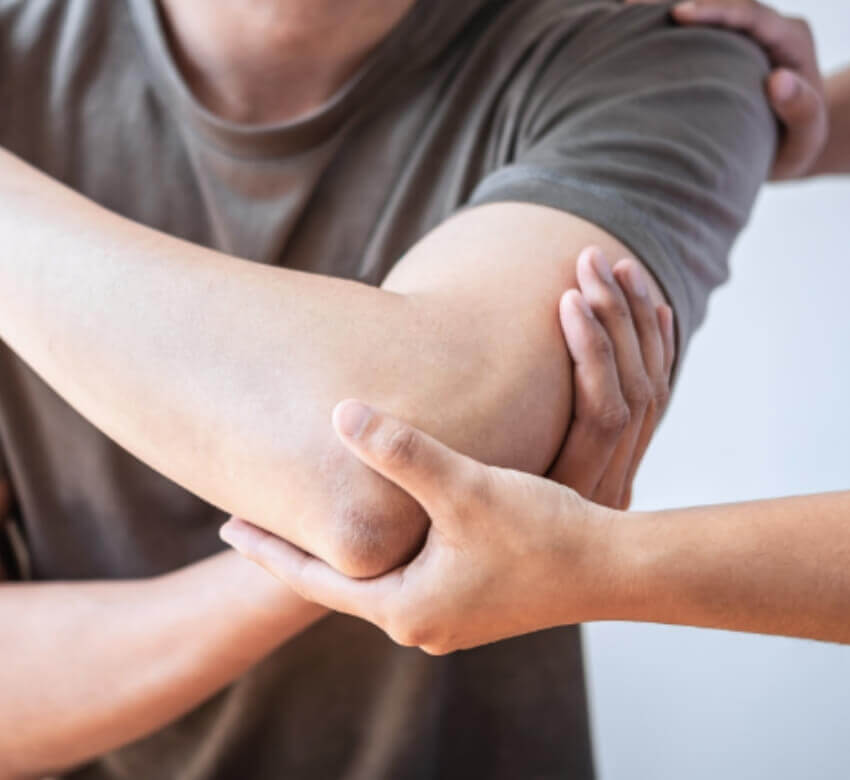 close up of hand holding elbow