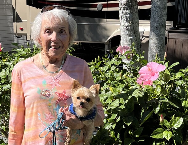 elbow arthritis surgery replacement patient Judy outside with her dog