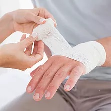 wrapping hand in bandage