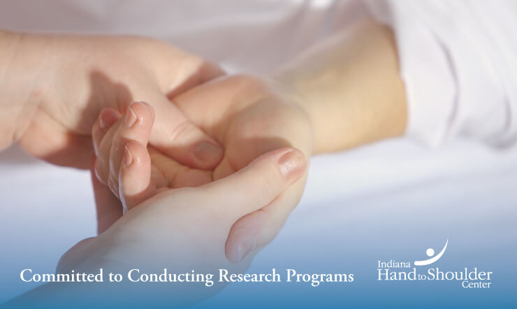 Examining a hand with text overlay "Committed to Conducting Research Programs"