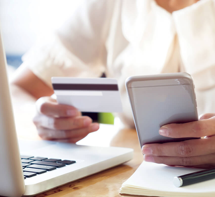 woman paying by credit card on her phone