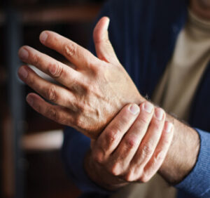 man holding wrist